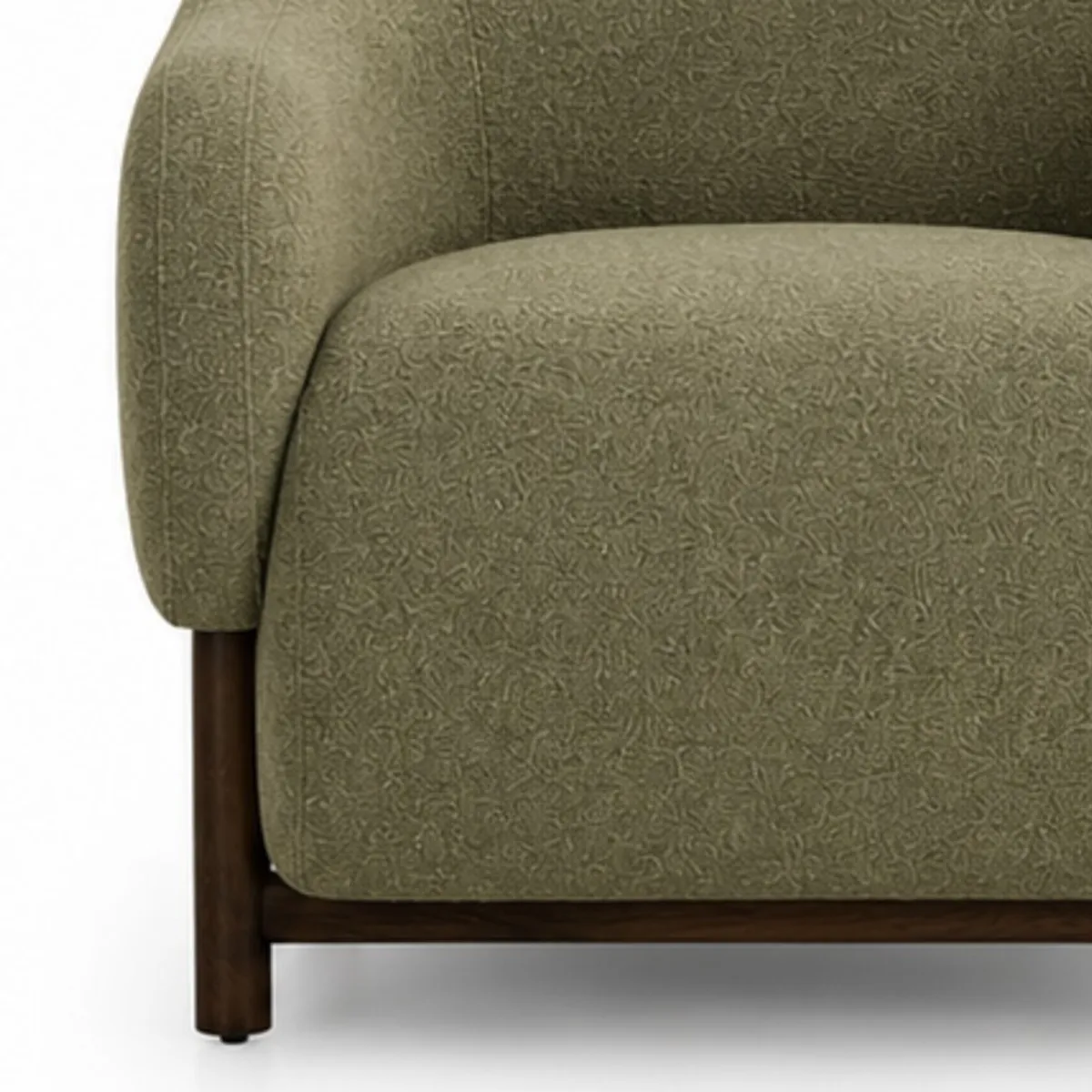 Close-up of textured sage green upholstery and teak wood chair frame