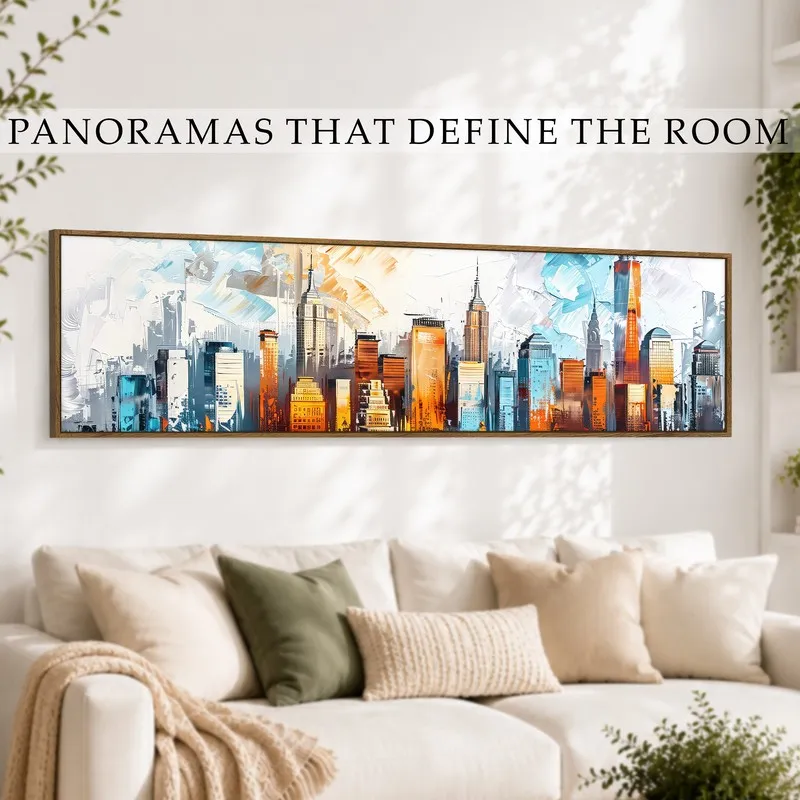 Wide cityscape canvas styled above a white sofa in an airy living room.