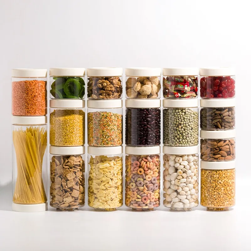 Eighteen clear round containers with white lids arranged in rows