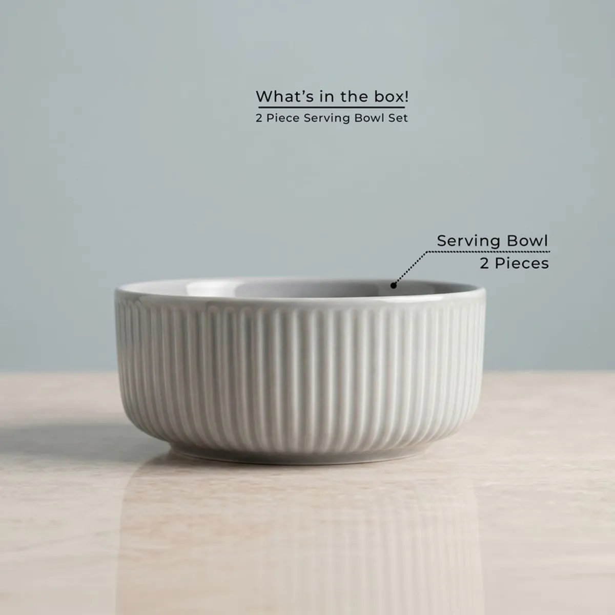Single grey ribbed round serving bowl on a tabletop
