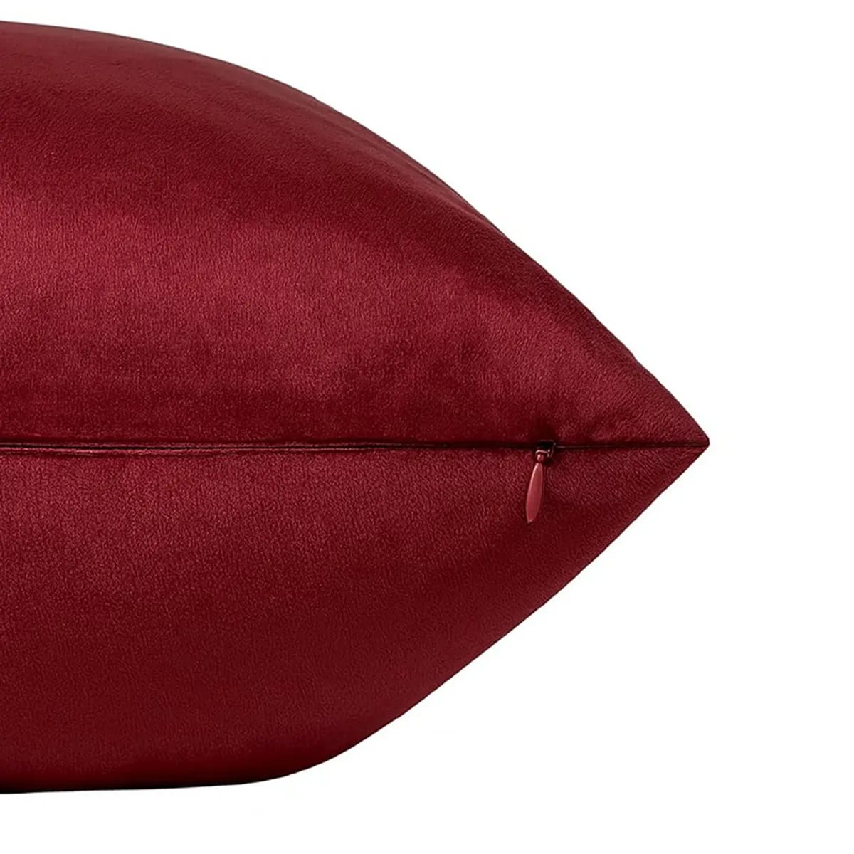 Close-up of maroon velvet cushion cover showing its zip closure