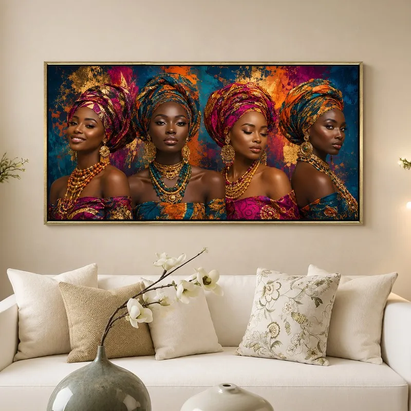Framed multicolour portrait wall art displayed above a white sofa with neutral cushions.