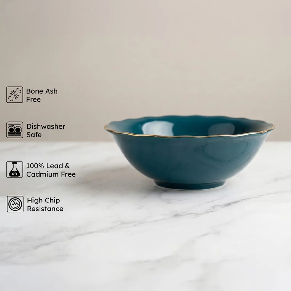 Dark teal serving bowl with gold rim shown from the side