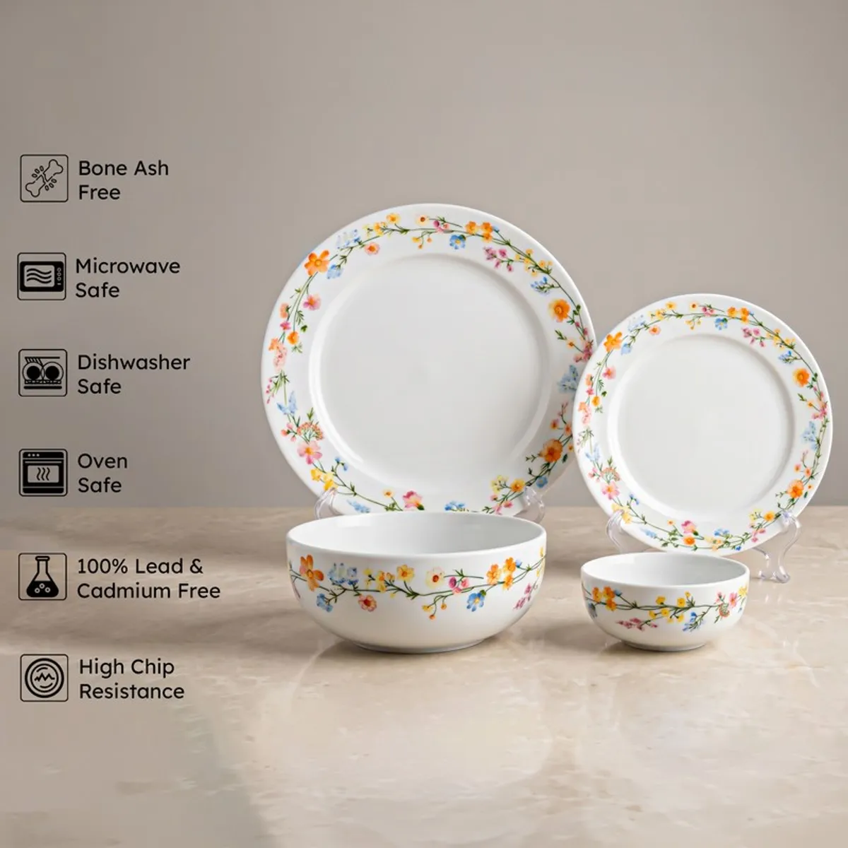 Porcelain floral plates and bowls displayed together on stands