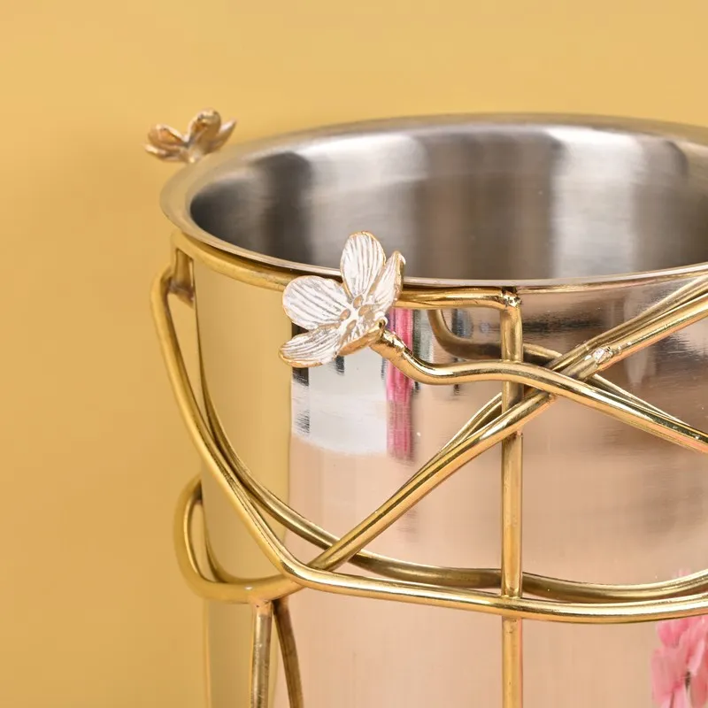Close-up of the silver bucket rim and gold floral detailing