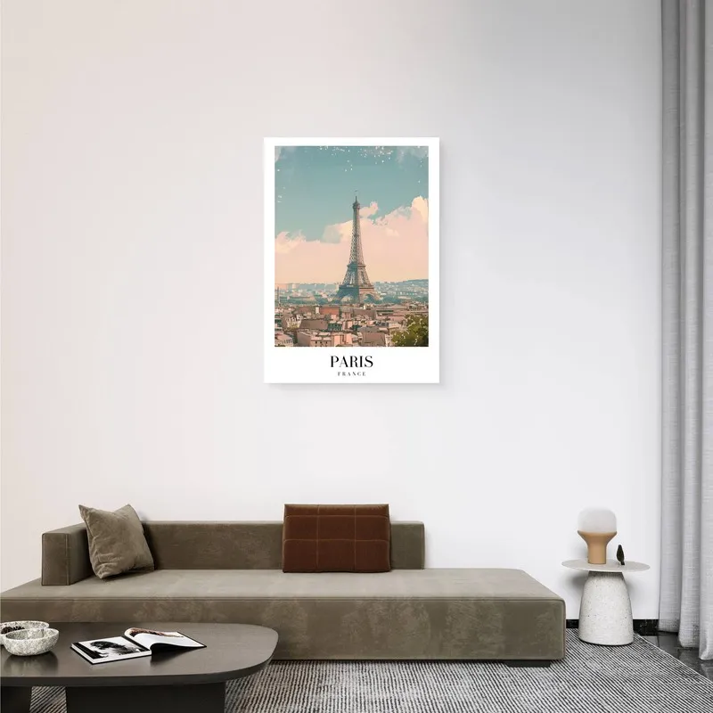 Paris canvas wall art displayed above a low modern sofa in a minimal room