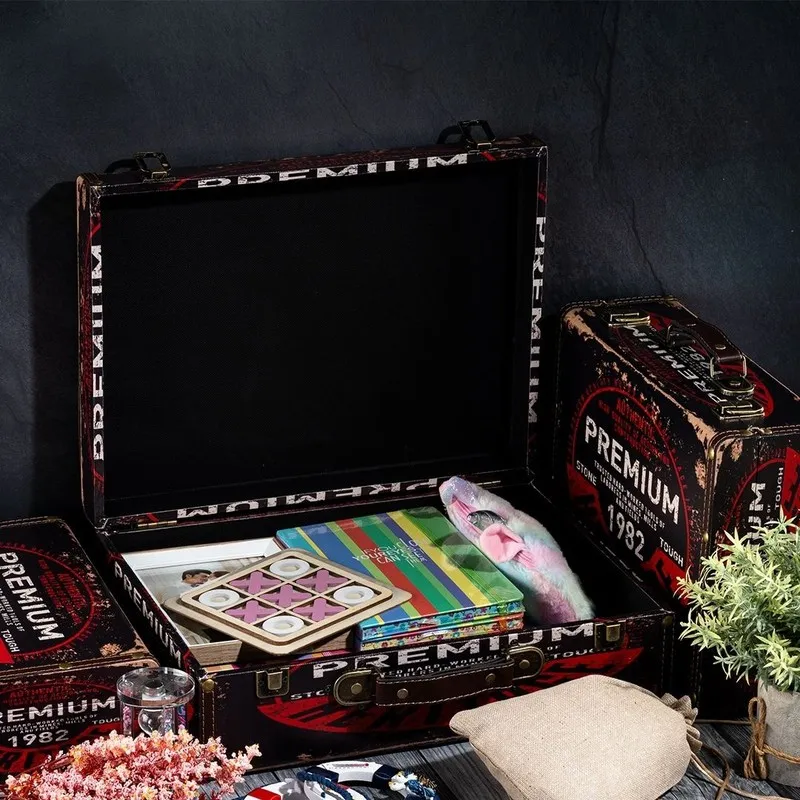 Open vintage storage box showing roomy interior with books and small items