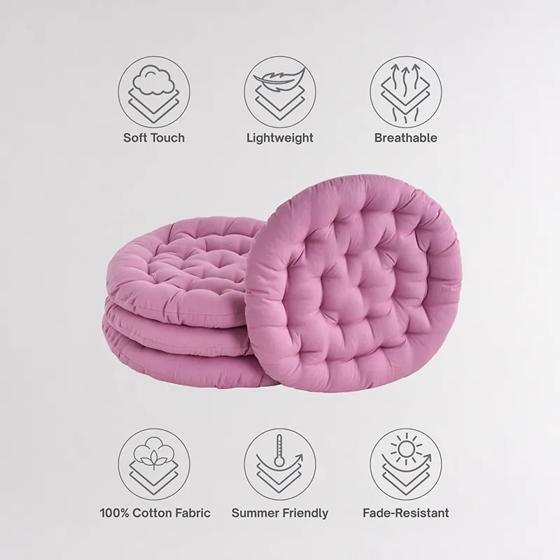 Stack of round lilac floor cushions with one cushion standing upright.