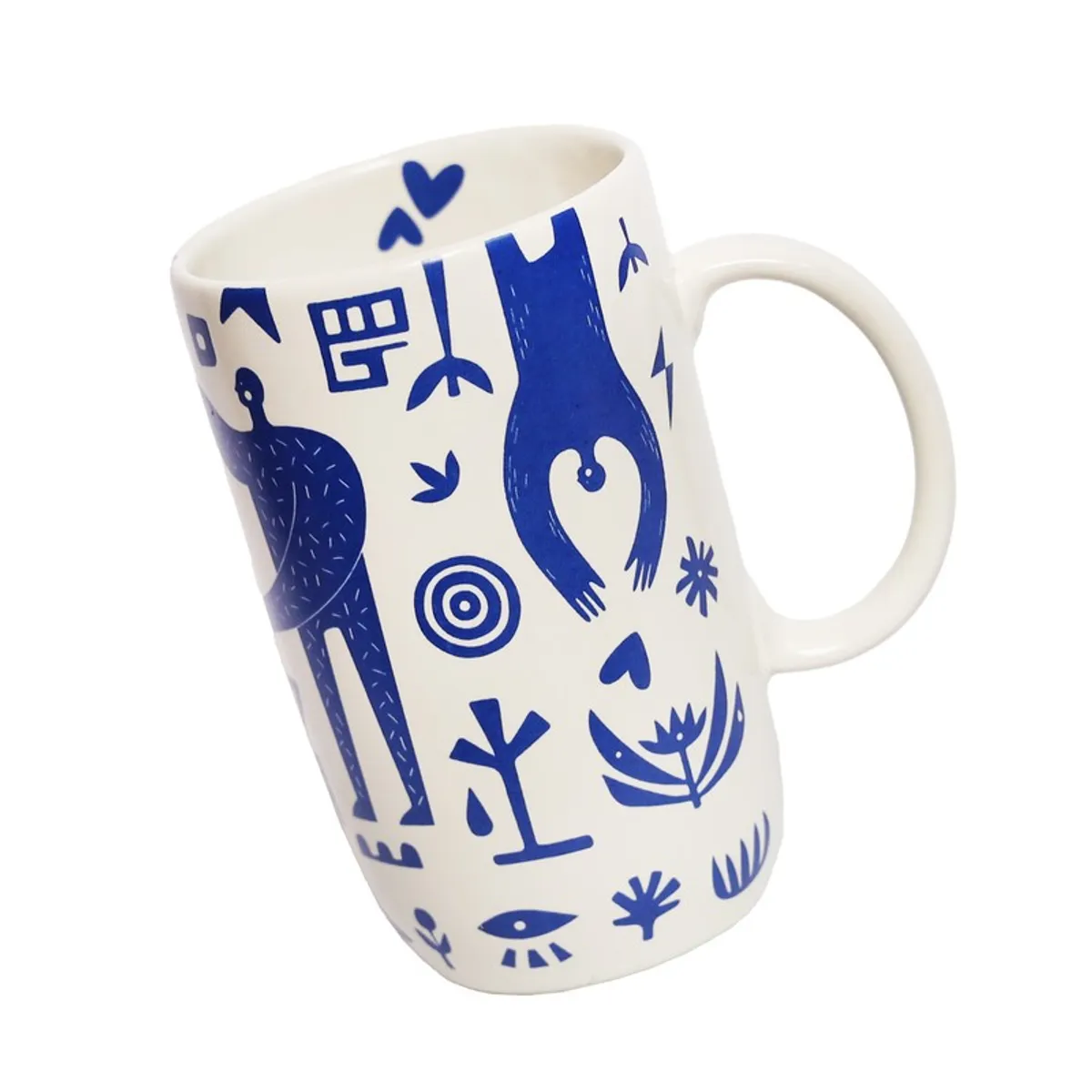 Angled view of white mug with blue graphic artwork and handle