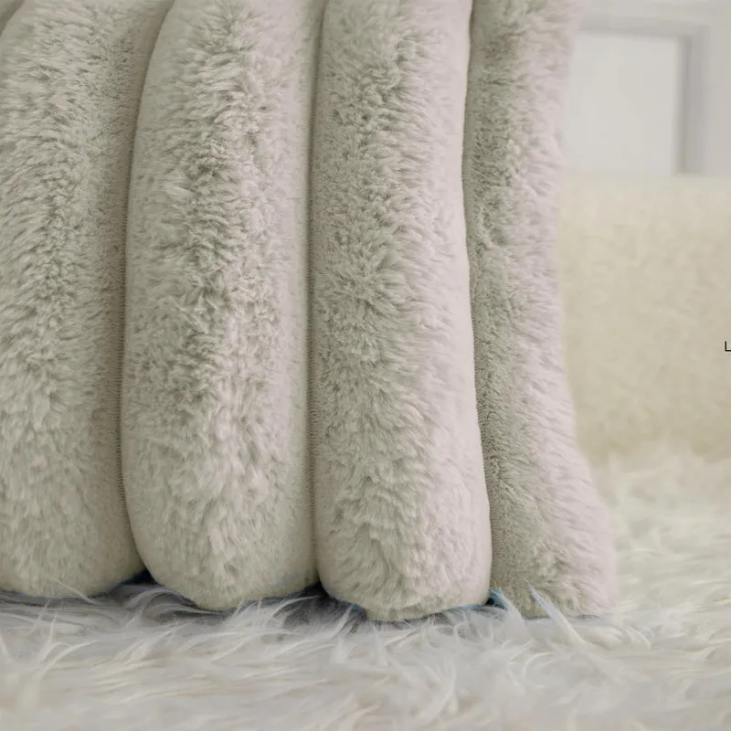 Close-up view of the cushion cover's soft raised pile and stripes.