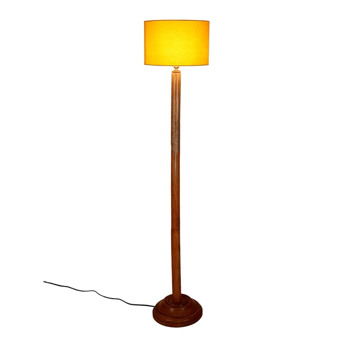 Wooden floor lamp with lit yellow drum shade on a white background