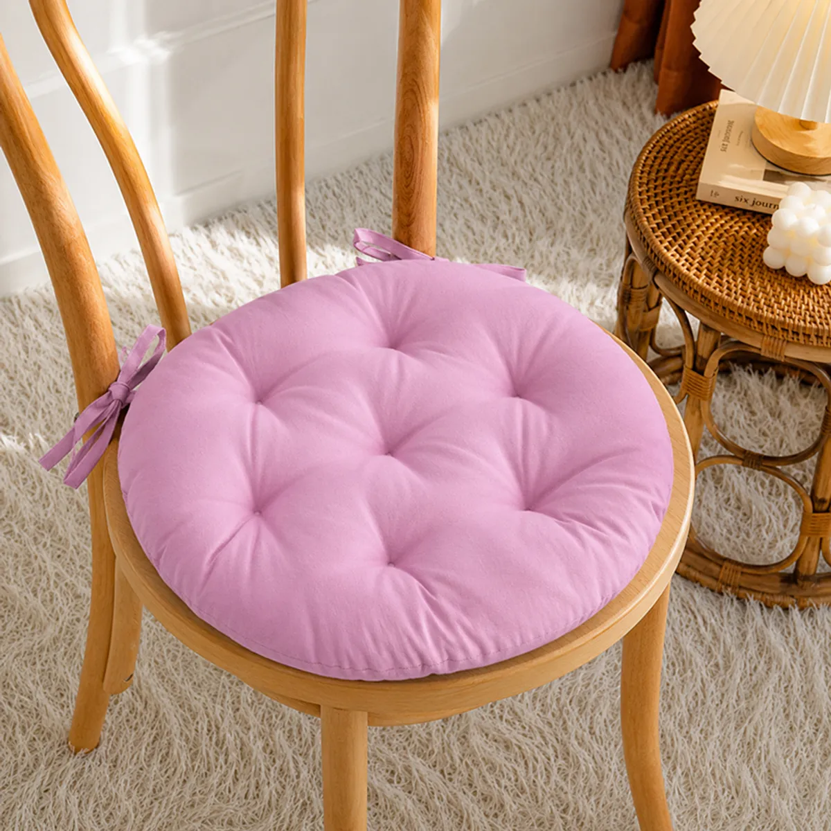 Lilac purple round chair pad tied to a wooden dining chair
