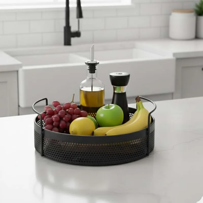 Round black metal basket with handles holding fruit and bottles