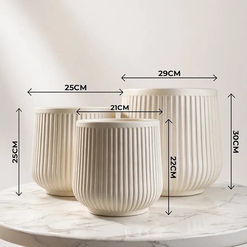 Three beige ribbed planters shown together with visible size differences.