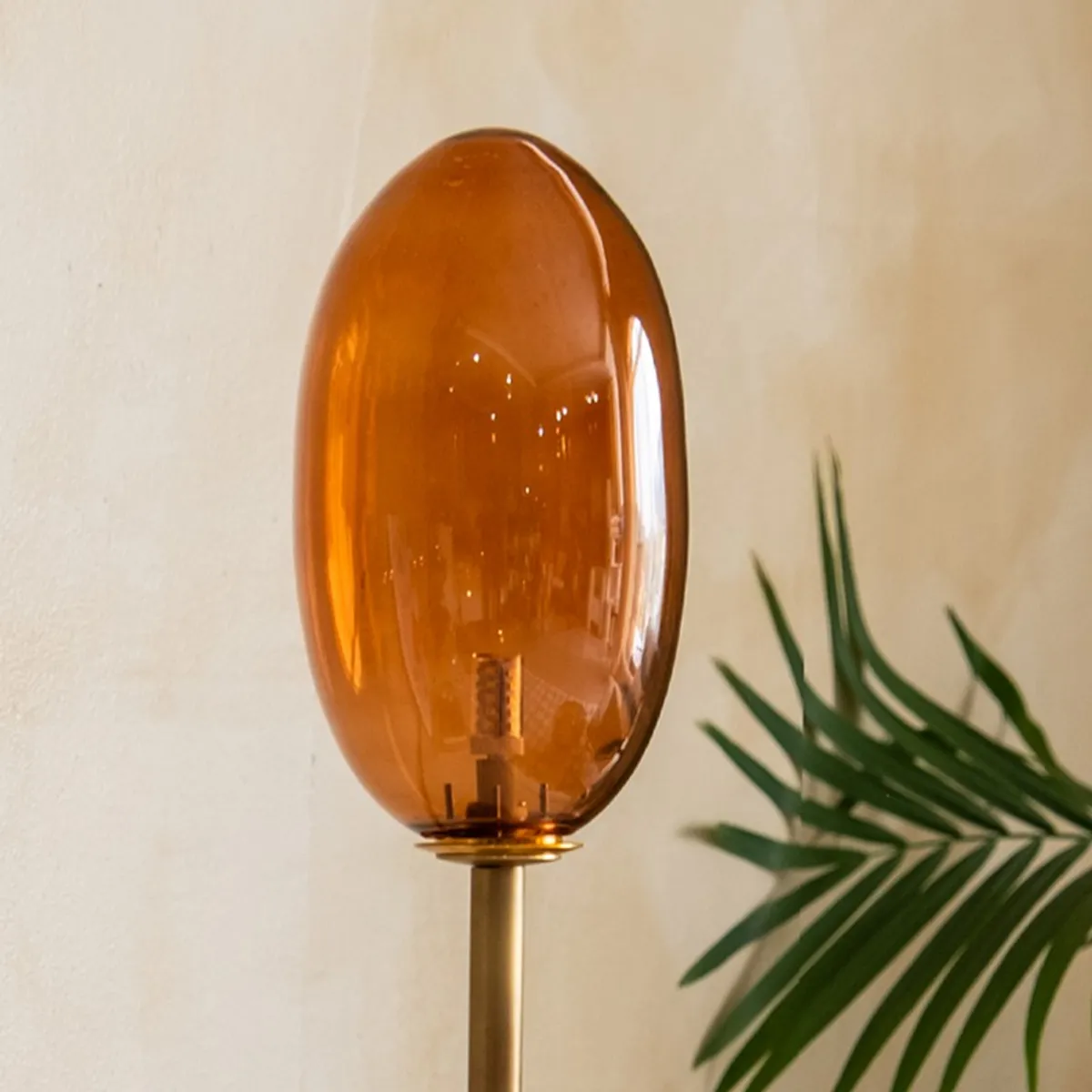 Close-up of the amber glass shade on the table lamp