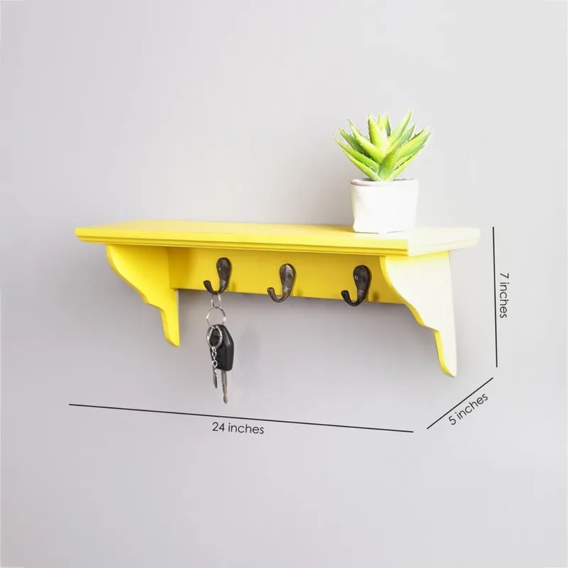 Yellow wall-mounted shelf with three hooks shown with size markings