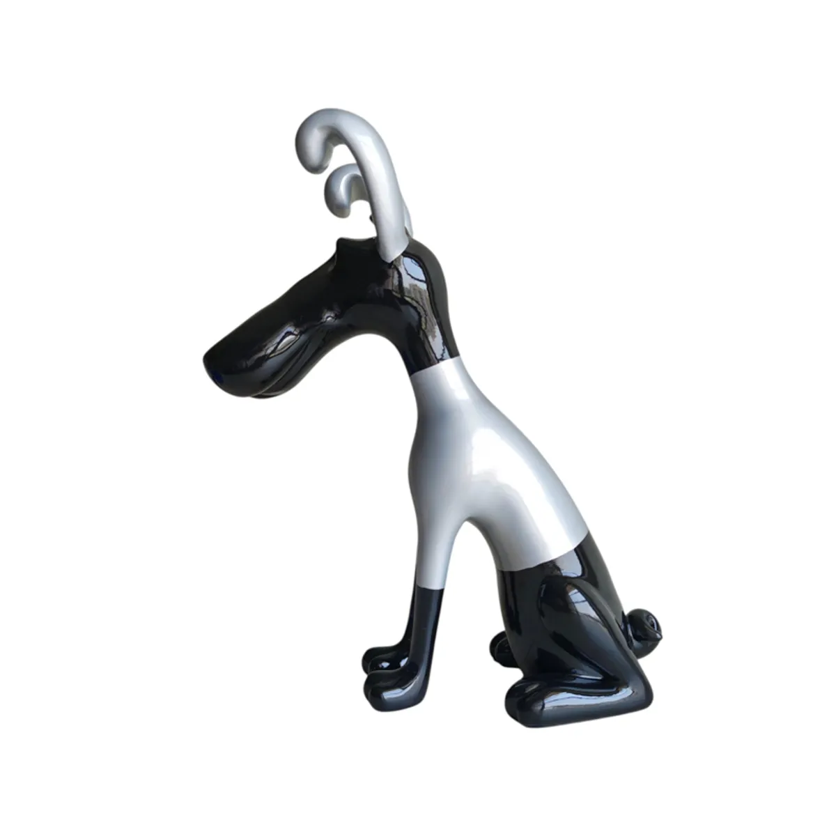Side view of the black and silver sitting hound showpiece