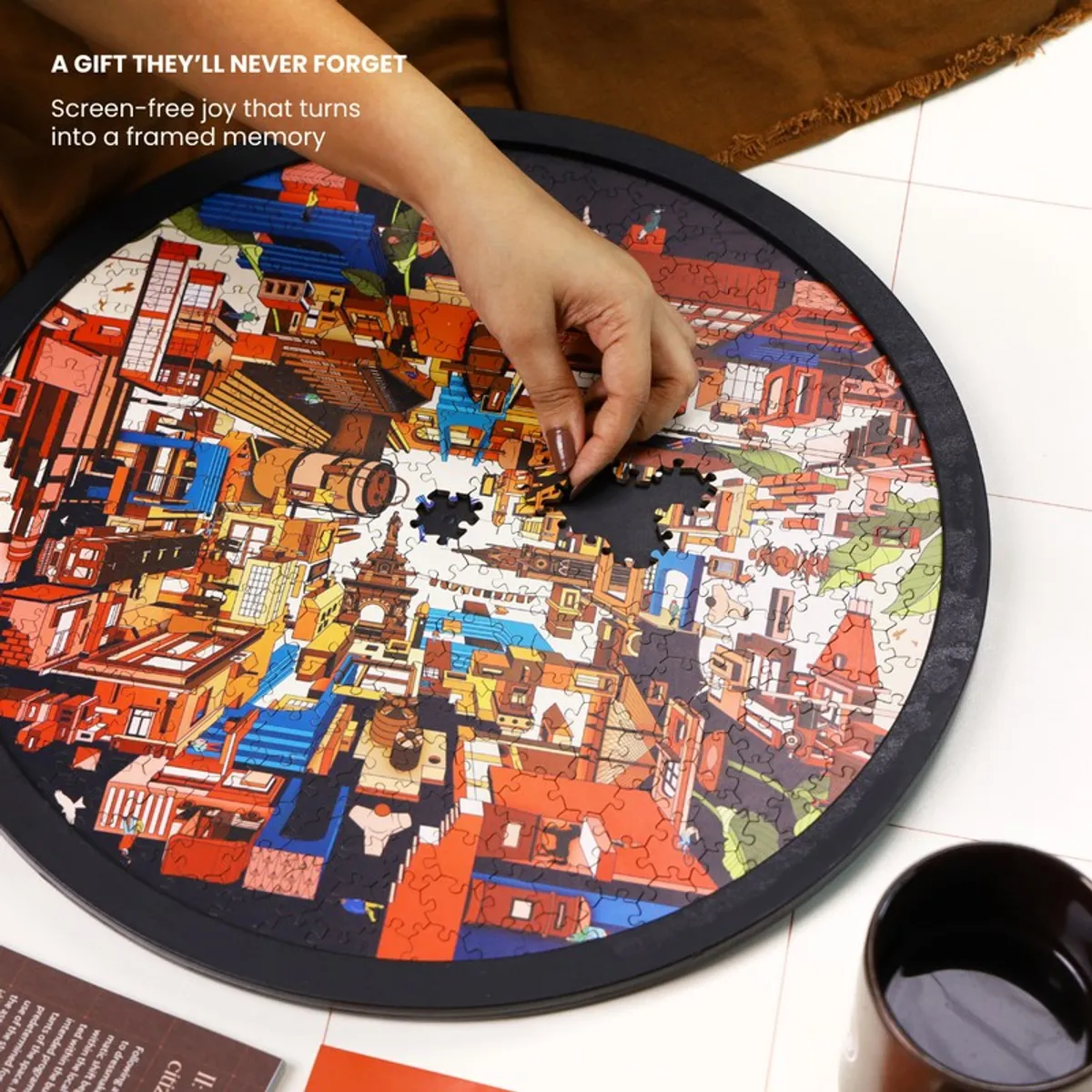 Hand placing a puzzle piece into the round cityscape wall art