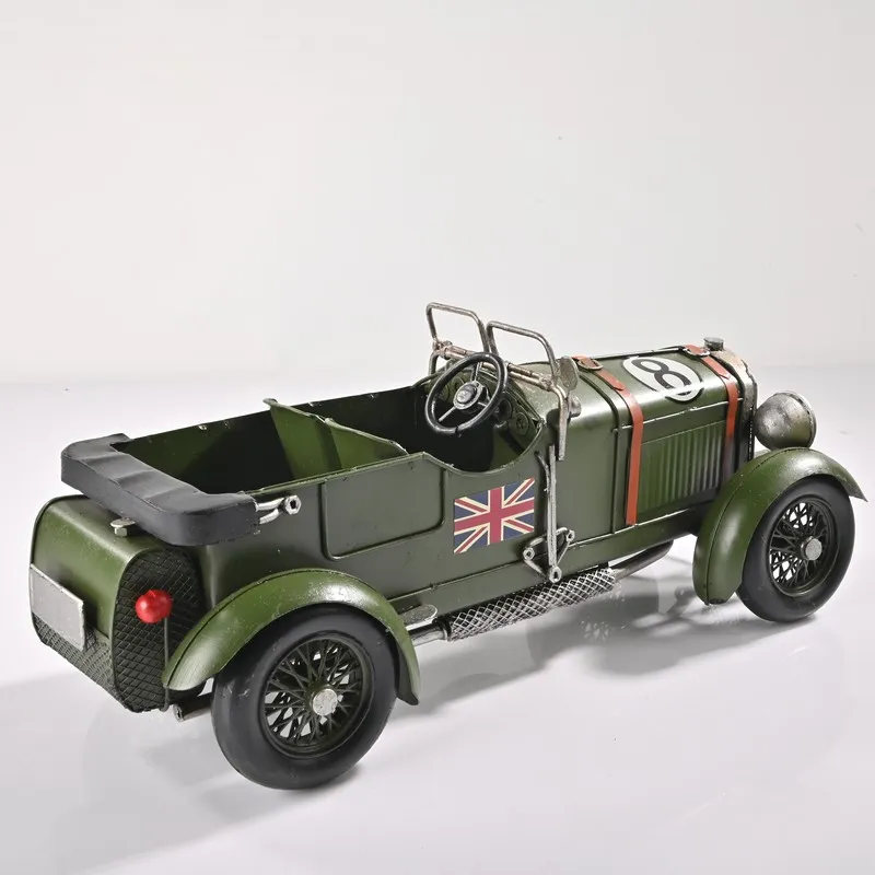 Rear angled view of the olive green vintage racer car showpiece