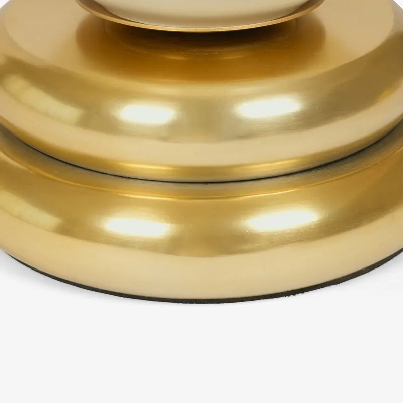Close-up of the metallic gold base with rounded tiers