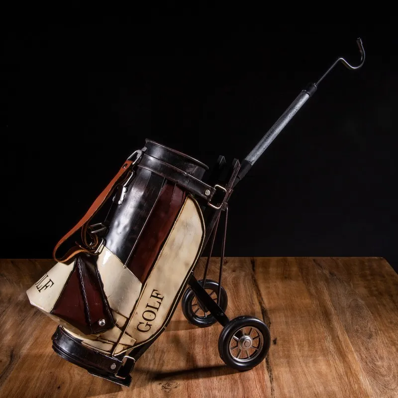 Golf kit miniature iron showpiece displayed on a wooden surface