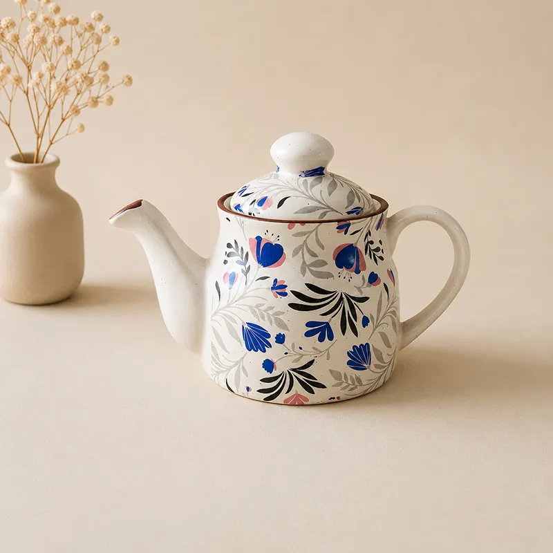 Glossy floral ceramic tea pot with lid and curved spout