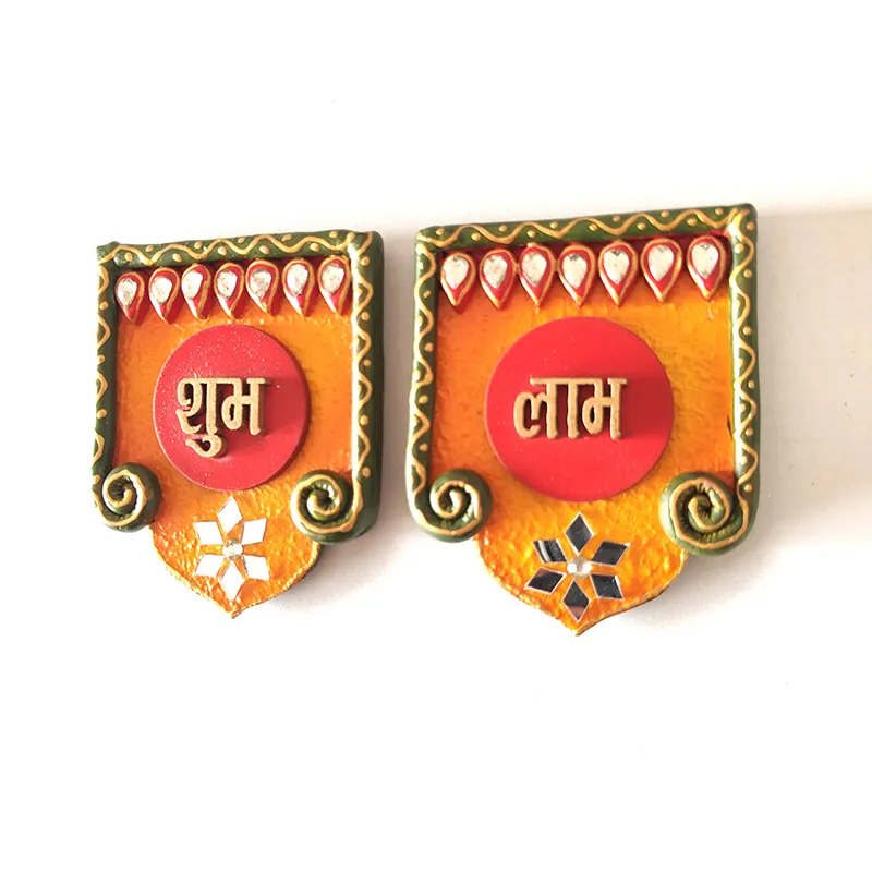 Close view of the two ornate Shubh Labh wall accents