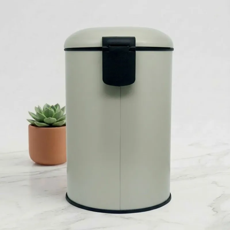 Rear view of beige cylindrical dustbin with black back handle