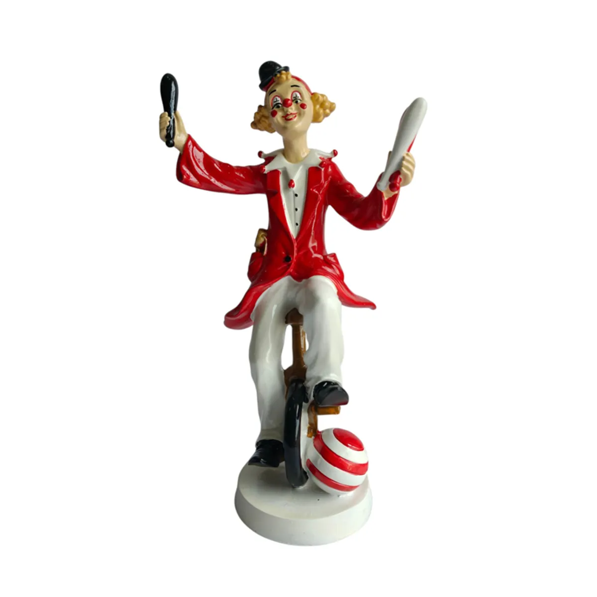 Front view showing the clown figurine's expressive face and unicycle