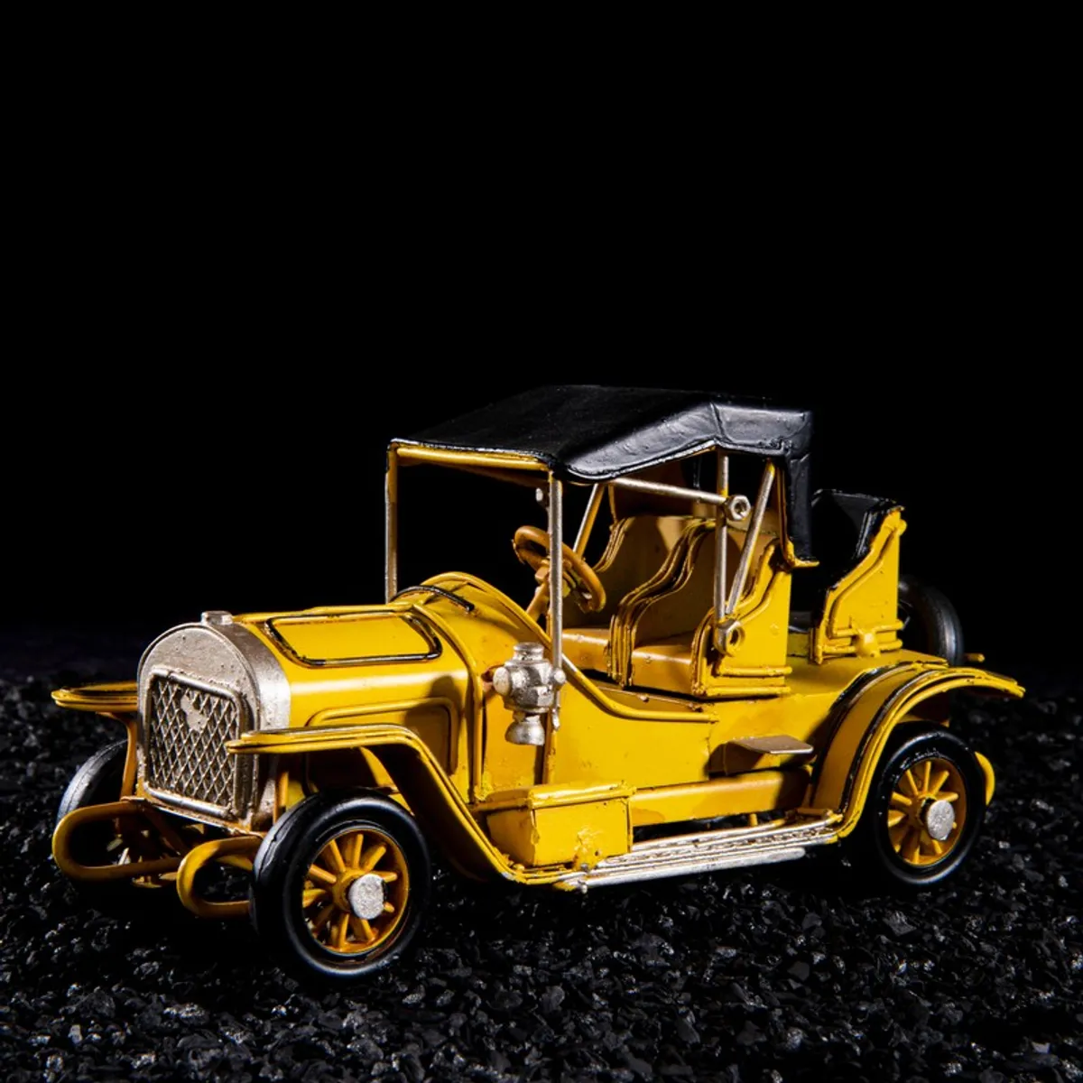 Angled view of yellow vintage car tabletop showpiece