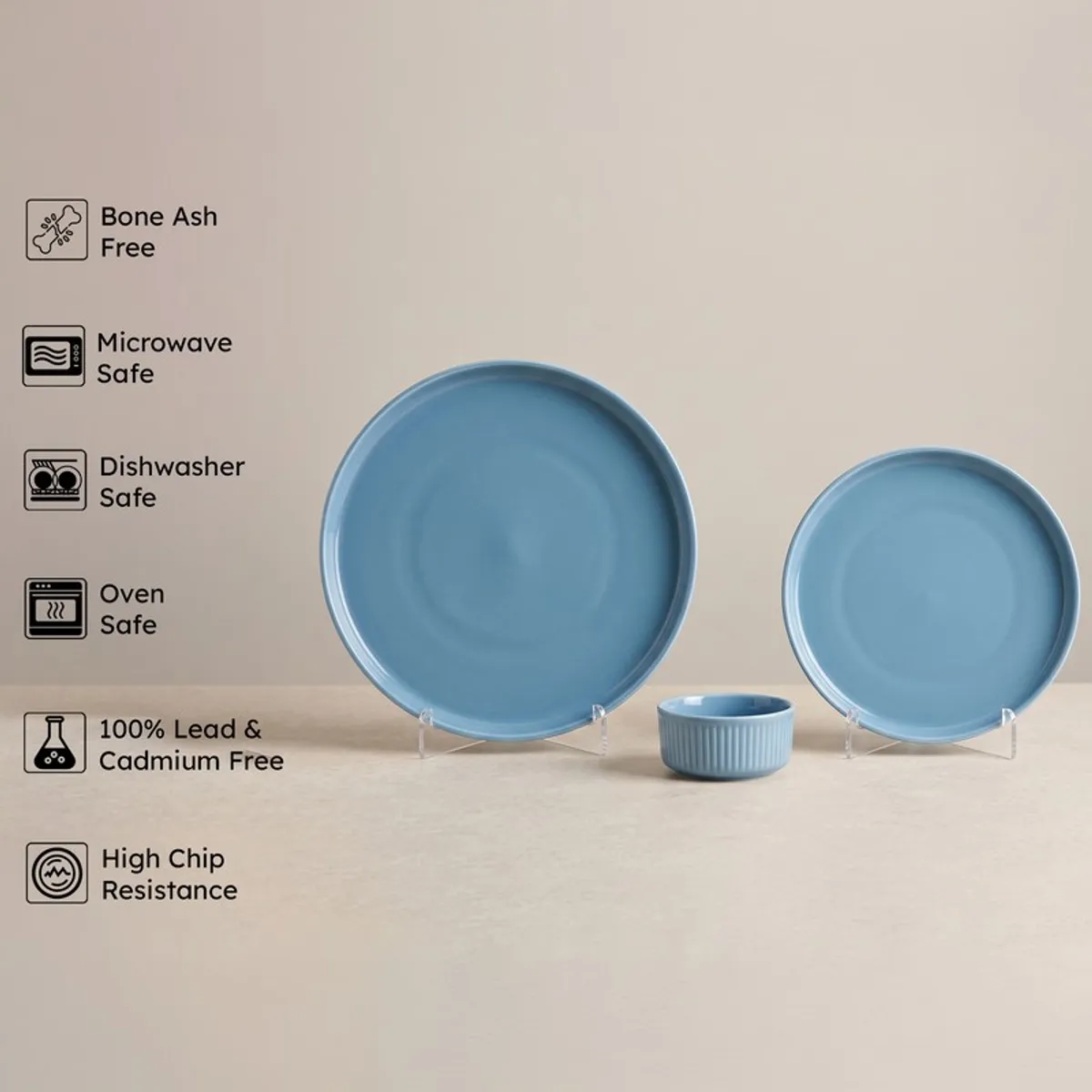 Blue dinner plate, side plate and bowl with feature icons beside them