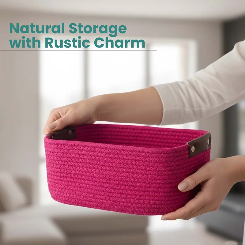 Hands holding a dark pink rectangular storage basket with side handles