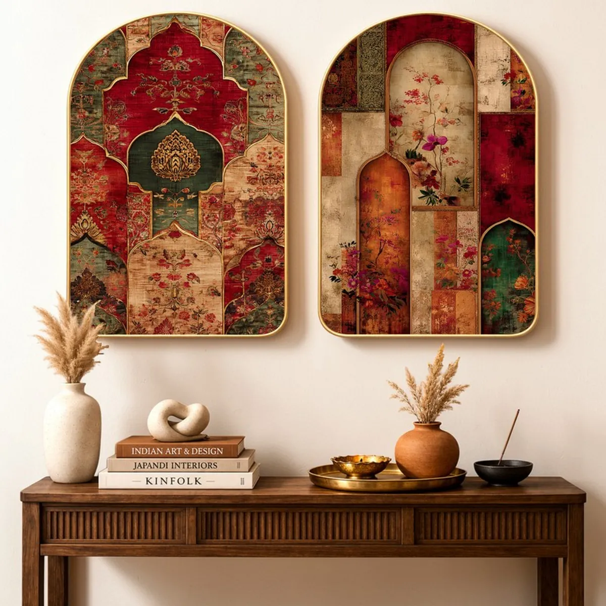 Set of two Mughal-style wall art panels with floral motifs above a console table