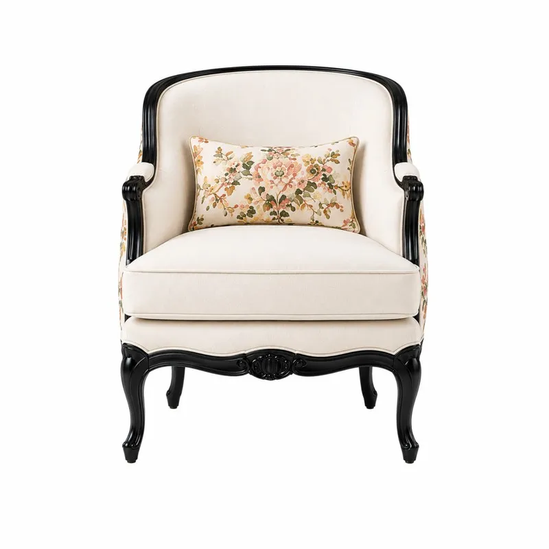 Front view of off-white accent chair with black frame and floral lumbar cushion