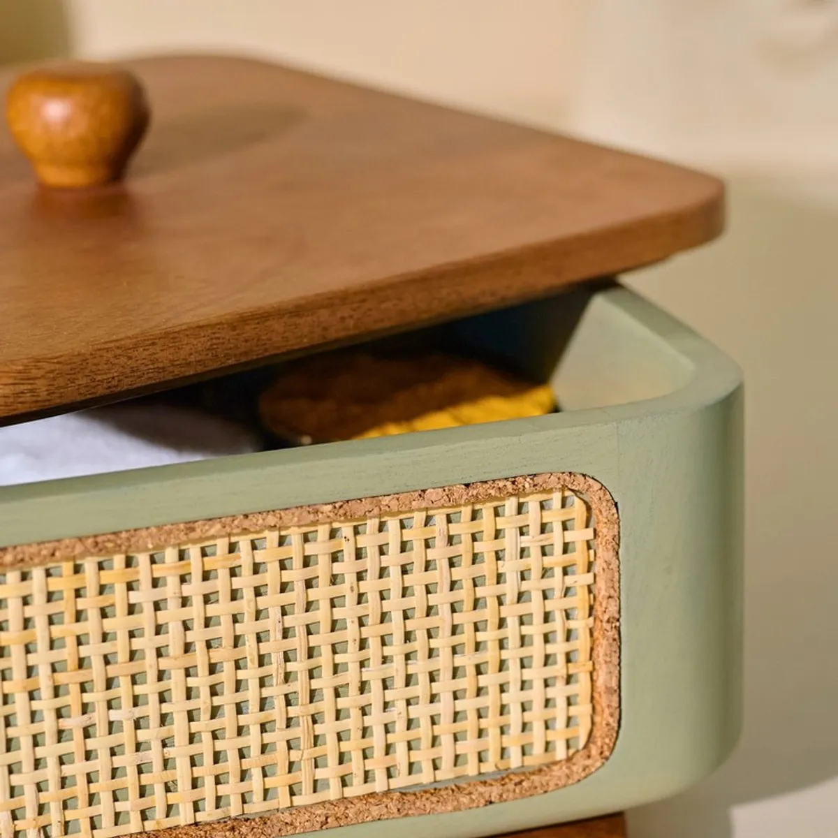 Close-up of the wood lid and textured front panel on the masala box