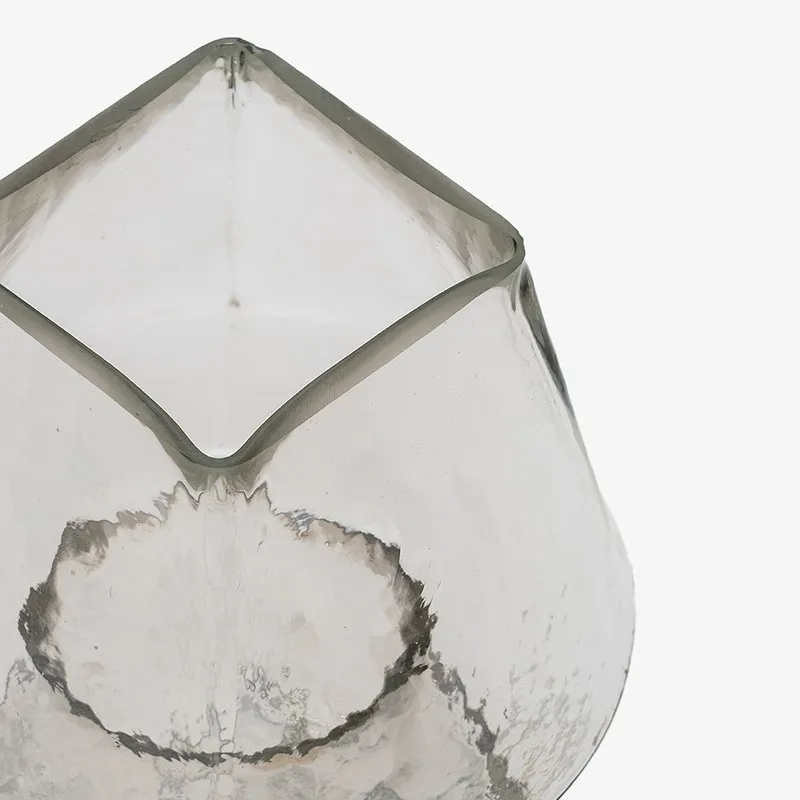 Top angled view of the clear glass lamp base and opening