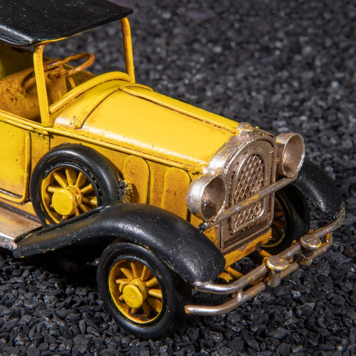 Close-up of the front grille and wheel details of the model car