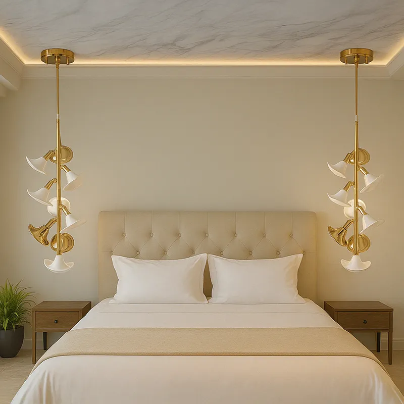 Pair of gold and white floral hanging lamps styled above bedside tables