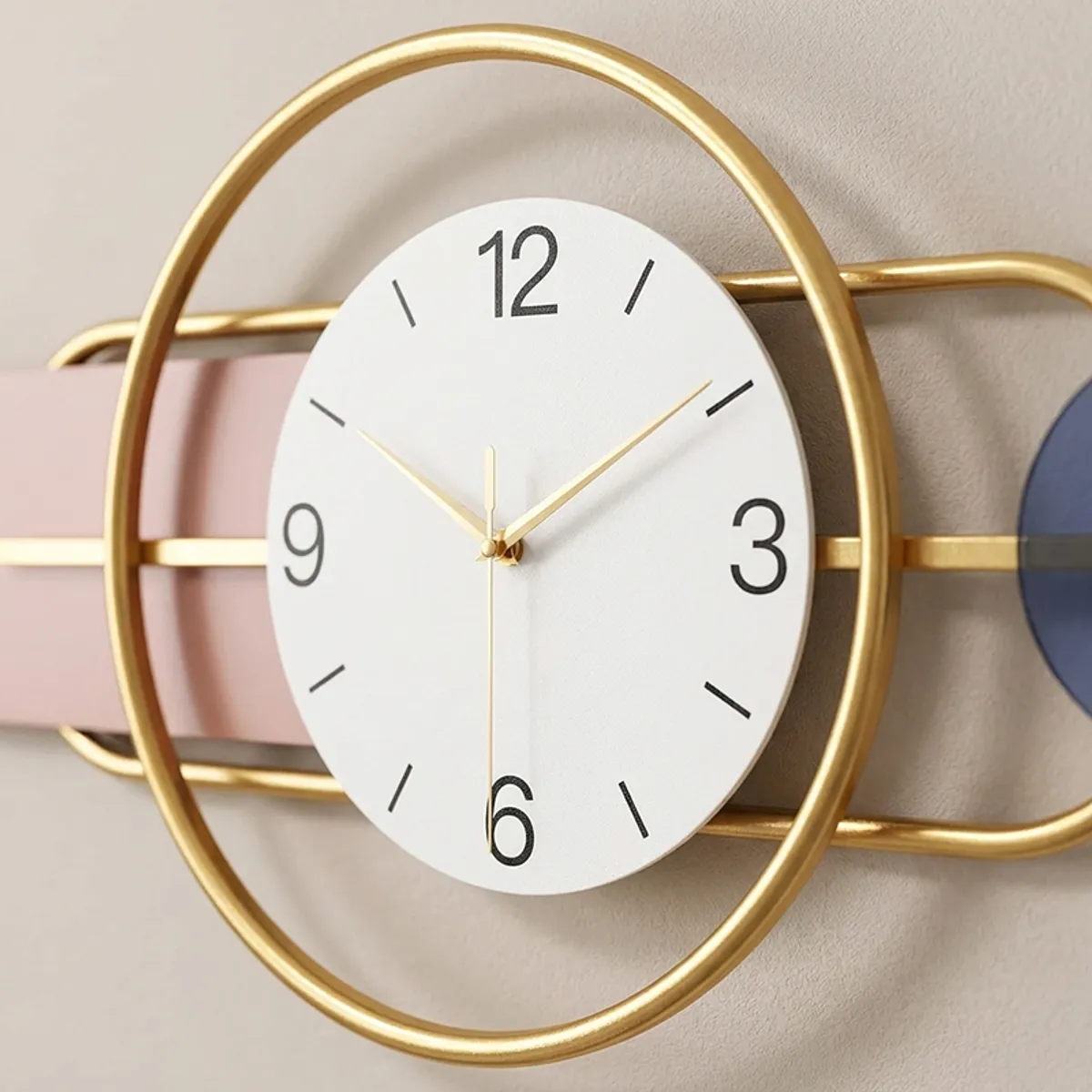 Close-up of round white clock face with gold frame and black numerals