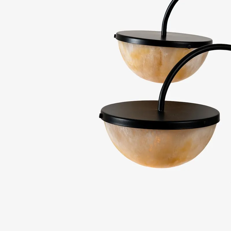 Close-up of two marbled semi-sphere resin shades with black rims