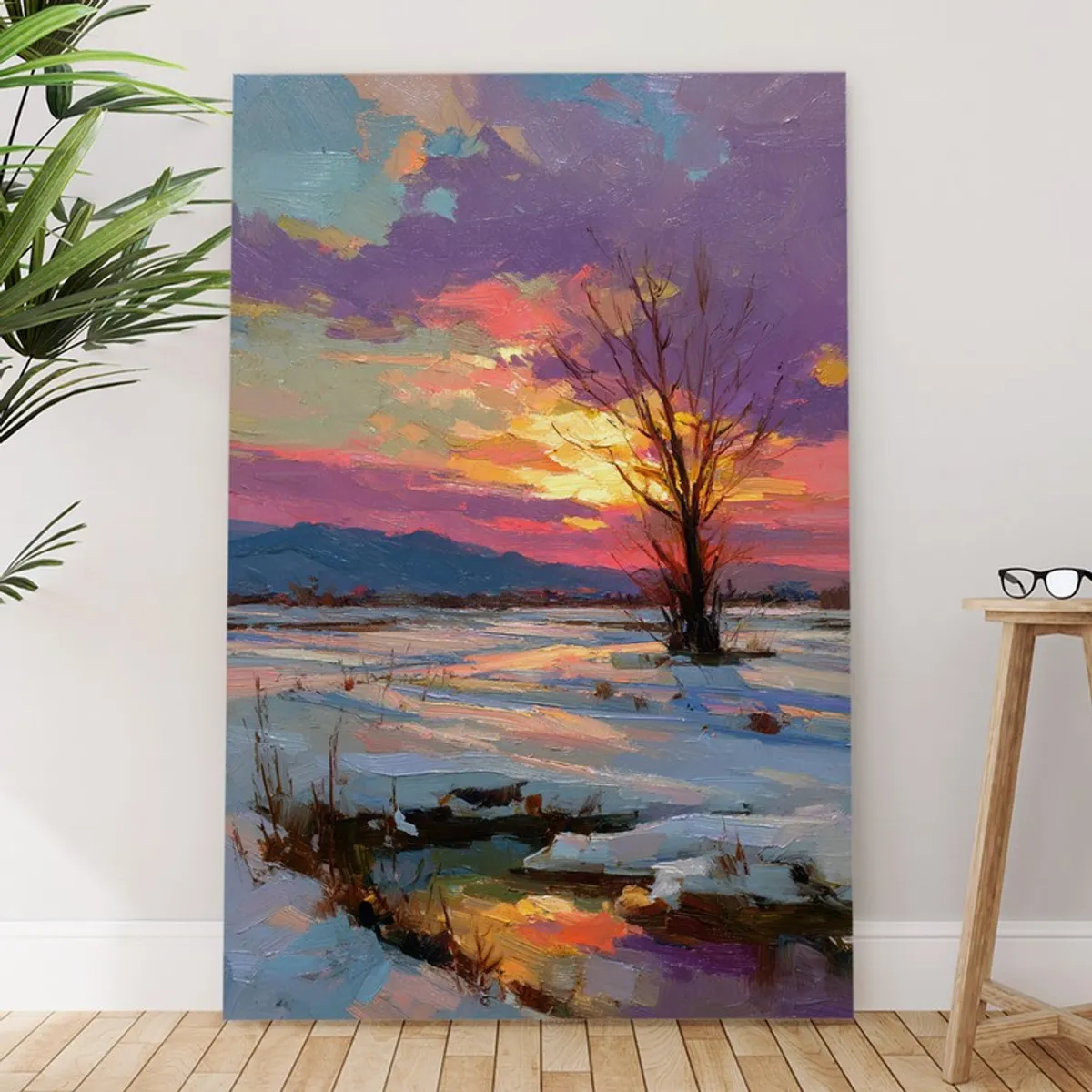 Winter sunset canvas wall painting leaning against a wall beside a stool