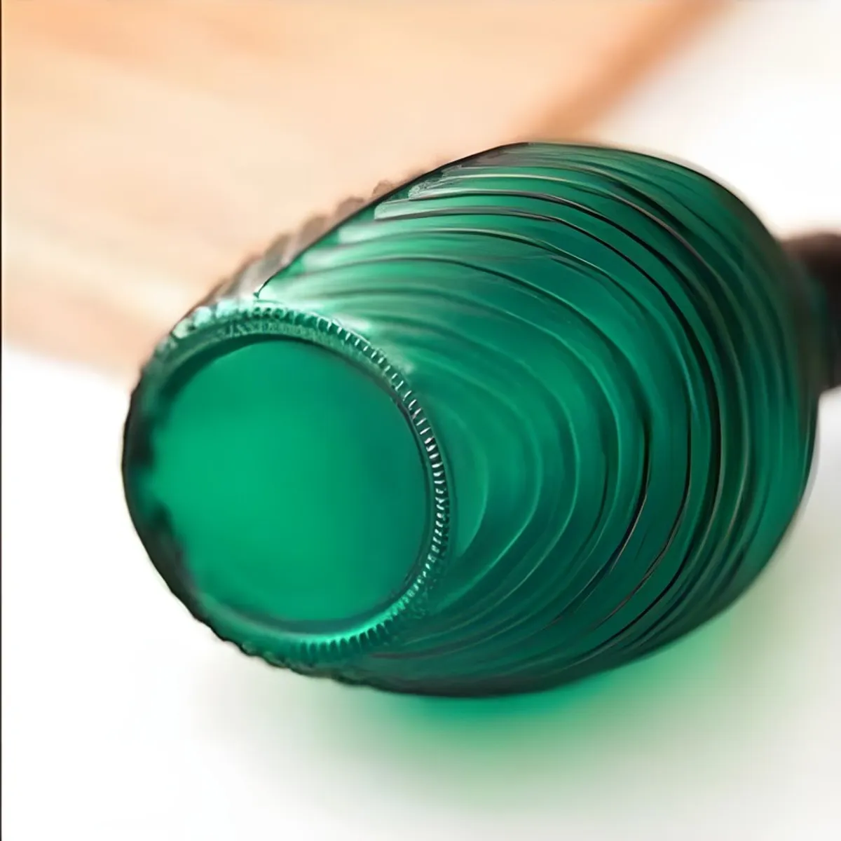 Base detail of the textured green glass soap dispenser
