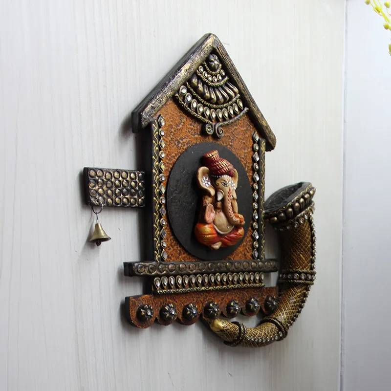 Angled side view of the Ganesha wall accent with dimensional detailing