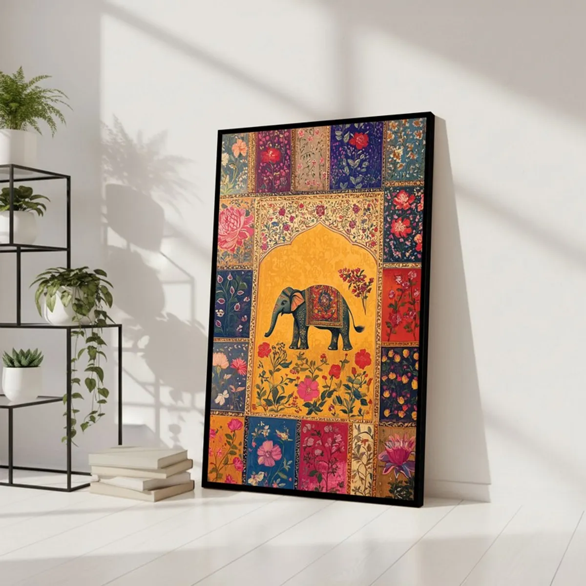 Framed elephant wall art with floral border leaning against a white wall