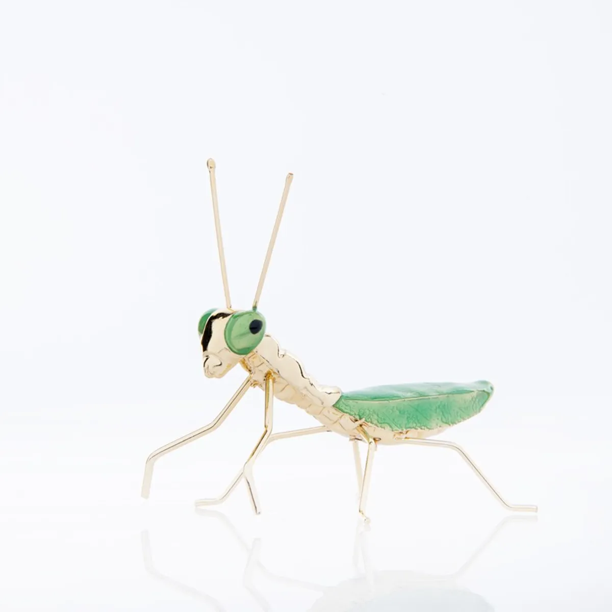 Angled view of green and gold praying mantis tabletop decor