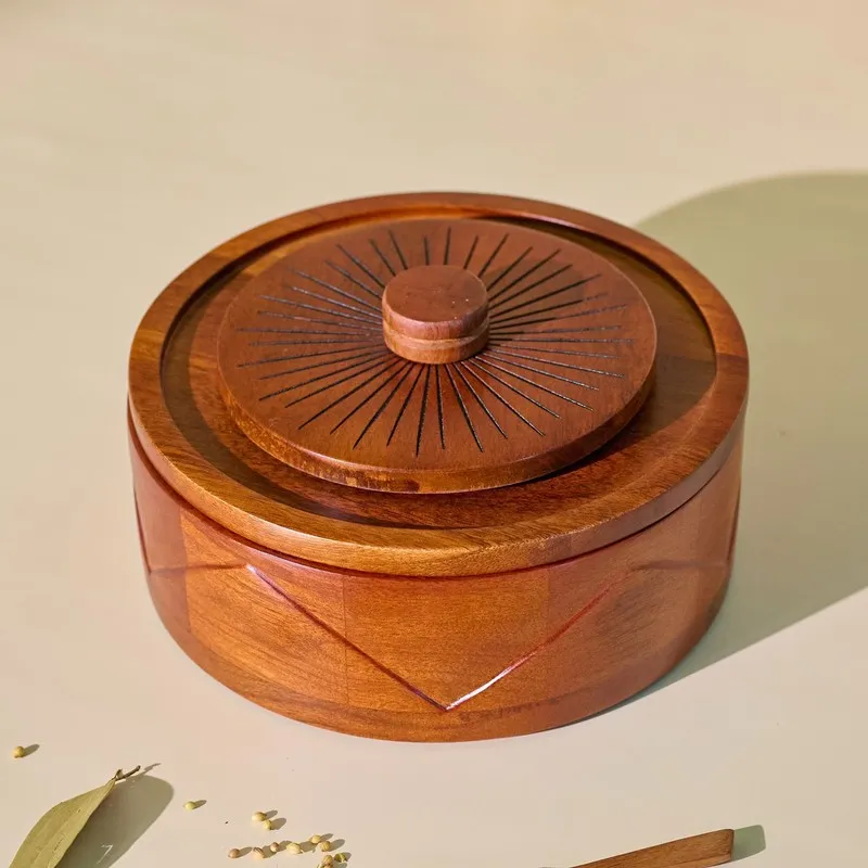 Closed glossy brown wooden masala box with sunburst lid