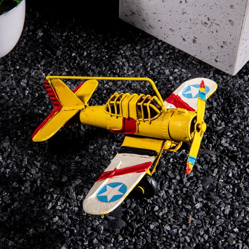 Top view of a yellow airplane showpiece with wing details