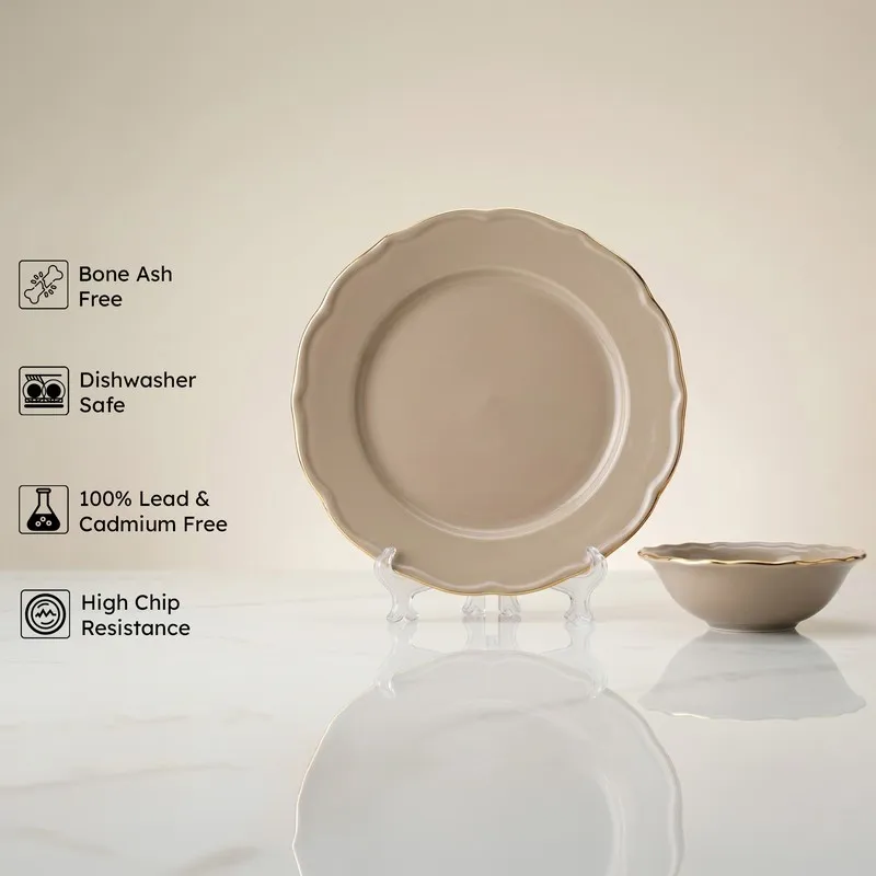 Grey round plate and bowl with scalloped edges and gold detailing