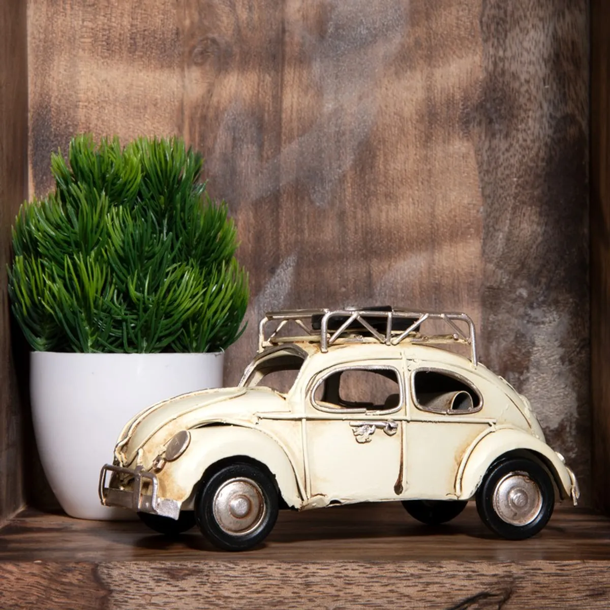 Side view of a white vintage car showpiece with roof rack
