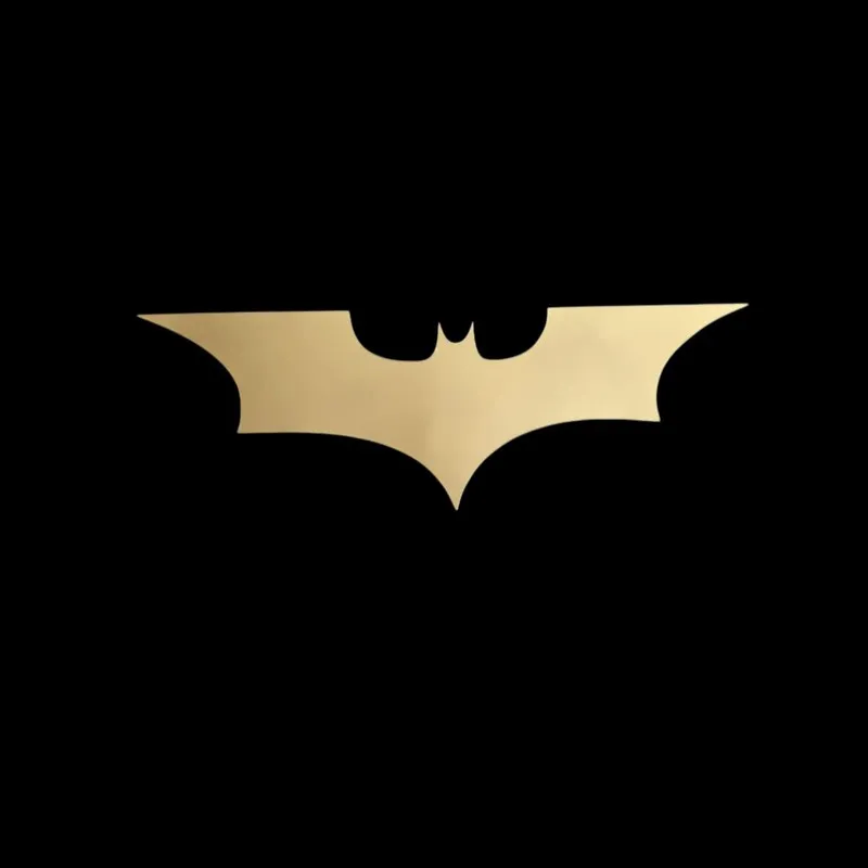 Gold Batman-shaped wall accent on a black background